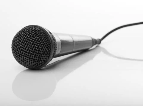 Microphone on reflecting background Stock Photos