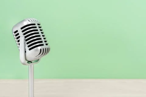 Microphone retro with copy space on table and greed background 스톡 사진