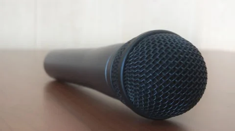 Microphone rolls on the table Stock Footage 46995479