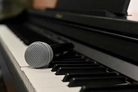 Microphone for singing on the keys of an electronic digital piano Stock Photos