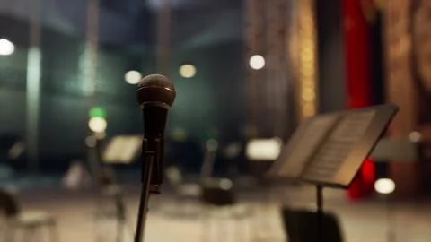 A microphone that is sitting in front of a microphone Illustrazione stock