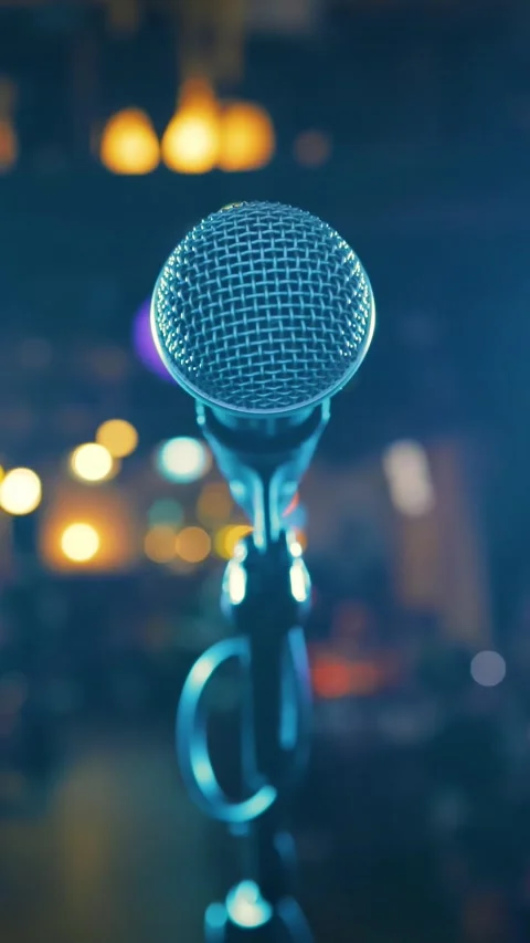 Microphone on stage against a background of auditorium. Stock Footage 346393956
