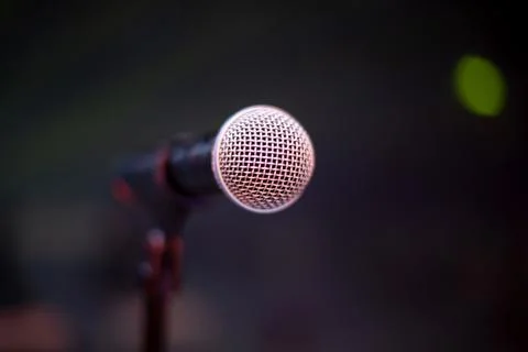 Microphone on the stage and empty hall during the rehearsal Stock Photos