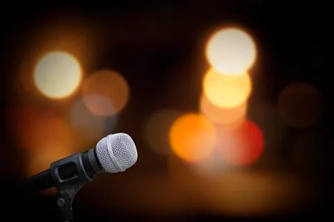 Microphone on stage background Stock Photos