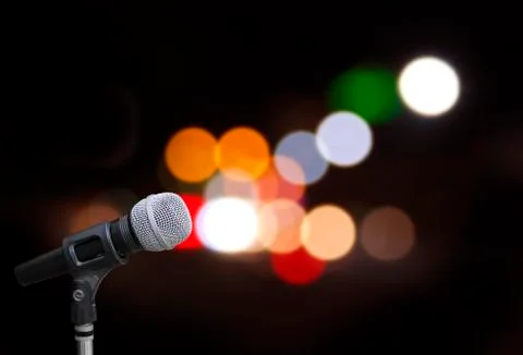 Microphone on stage background Stock Photos