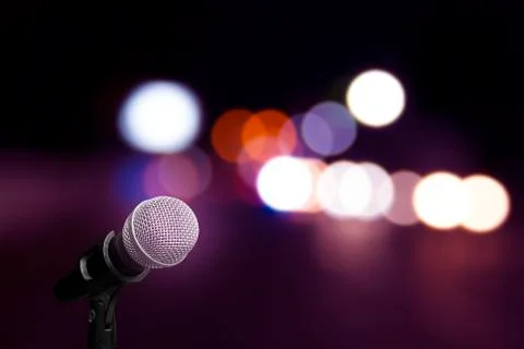 Microphone on stage background Stock Photos