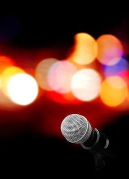 Microphone on stage background Stock Photos