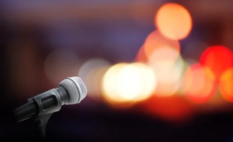 Microphone on stage background Stock Photos