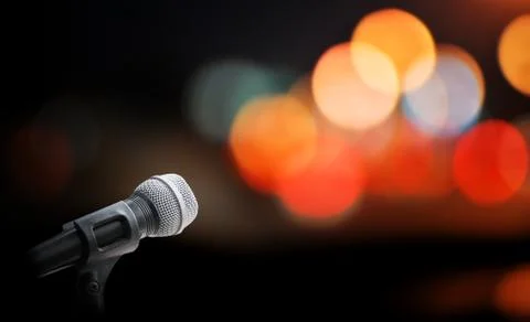 Microphone on stage background Stock Photos