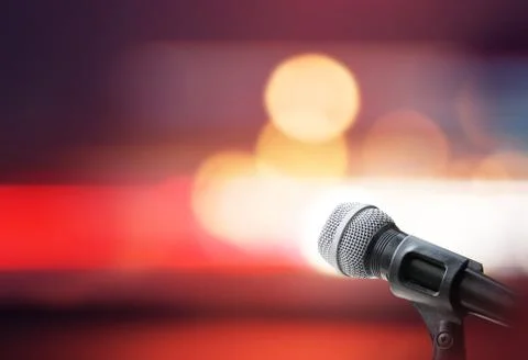 Microphone on stage background Stock Photos