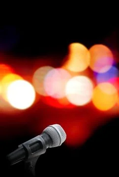 Microphone on stage background Stock Photos