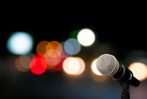 Microphone on stage background Stock Photos