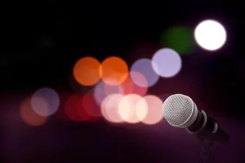 Microphone on stage background Stock Photos