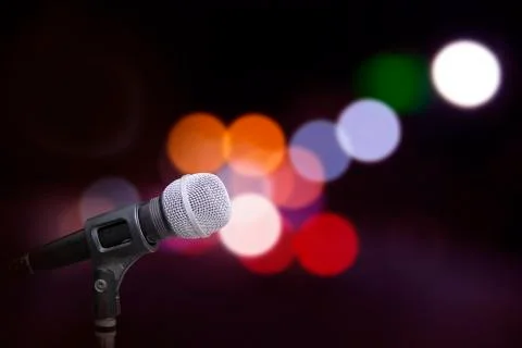 Microphone on stage background Stock Photos