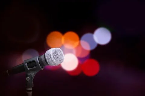 Microphone on stage background Stock Photos