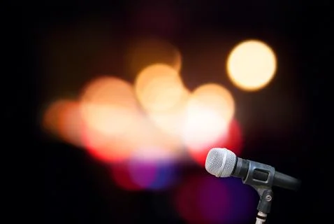 Microphone on stage background Stock Photos