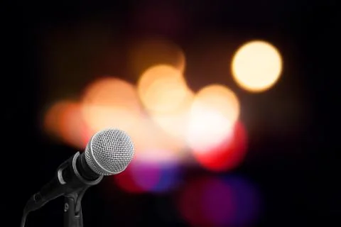 Microphone on stage background Stock Photos