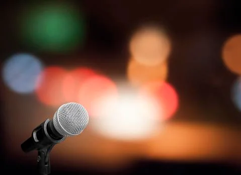 Microphone on stage background Stock Photos