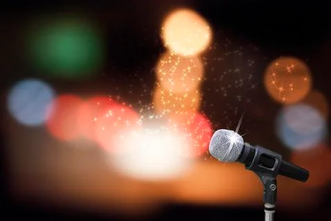 Microphone on stage background Stock Photos