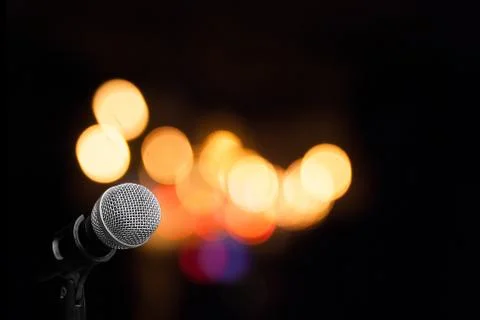 Microphone on stage background Stock Photos
