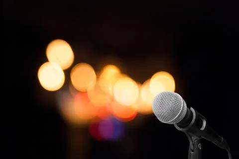 Microphone on stage background Stock Photos