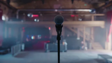 Microphone on stage, blinking light before the concert. Performances at the club Stock Footage 241998870