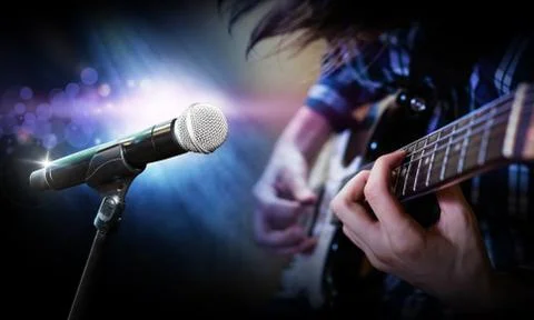 Microphone on stage blurred background playing guitarist on stage Stock Photos