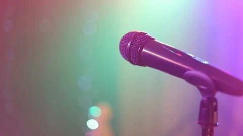Microphone on stage. Close-up. Dark background, smoke, spotlights. Stock Footage 120154456