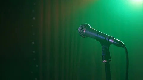 Microphone on stage. Close-up. Dark background, smoke, spotlights. Stock Footage 120154522