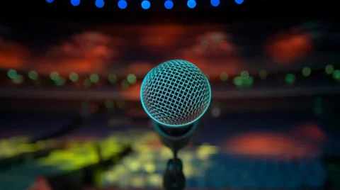 Microphone on stage, colorful spotlights Stock Footage