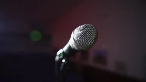 Microphone on Stage in Empty Auditorium Under Spotlight Stock Footage 314197225