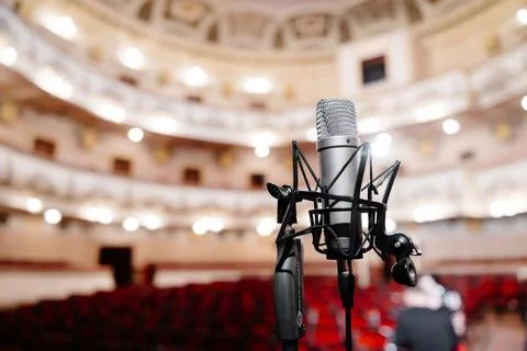 Microphone on the stage front of the empty hall before the concert Stock Photos