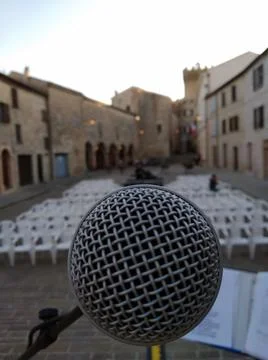 Microphone from the stage in a small square Stock Photos