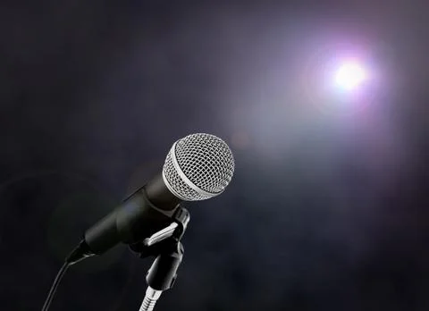 Microphone on stage with spotlight Stock Photos