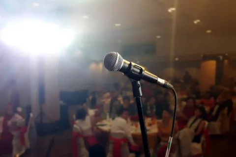 Microphone on stage under spotlight Stock Photos