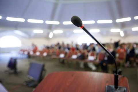 Microphone on stand in front of audience Stock Photos