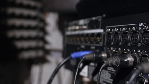 Microphone on a stand located in a music studio recording booth under low key Stock Footage 74667143