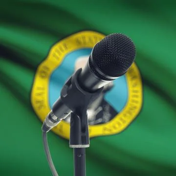 Microphone on stand with US state flag on background - Washington 写真素材
