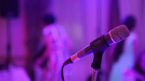 The microphone stands in the hall on the stage and waits for its performer. Stock Footage
