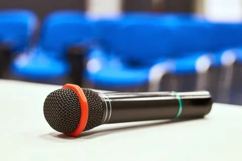 Microphone on the table in empty auditorium Stock Photos