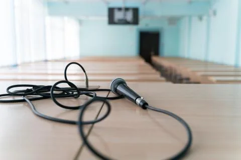 Microphone on a table in an empty classroom for lectures Stock Photos