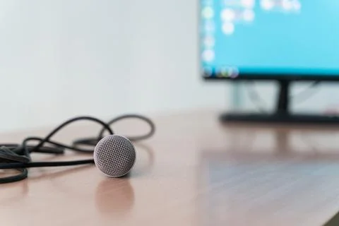Microphone on a table in an empty classroom for lectures at the university Stock Photos