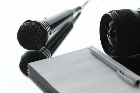 The microphone is on the table. Journalism concept. Stock Photos