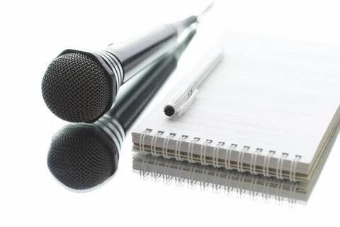 The microphone is on the table. Journalism concept. Stock Photos