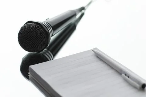 The microphone is on the table. Journalism concept. Stock Photos