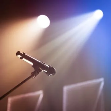 Microphone under bright stage lights Stock Photos