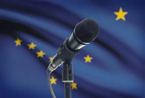 Microphone with US states flags on background series - Alaska Stock Photos