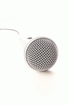 Microphone on a white background, selective focus on foreground with bright Stock Photos
