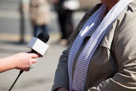 Microphone in woman's hand Stock Photos