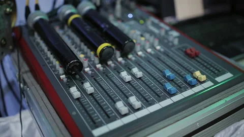 Microphones lie on the mixing console control engineer. Stock Footage 129704216